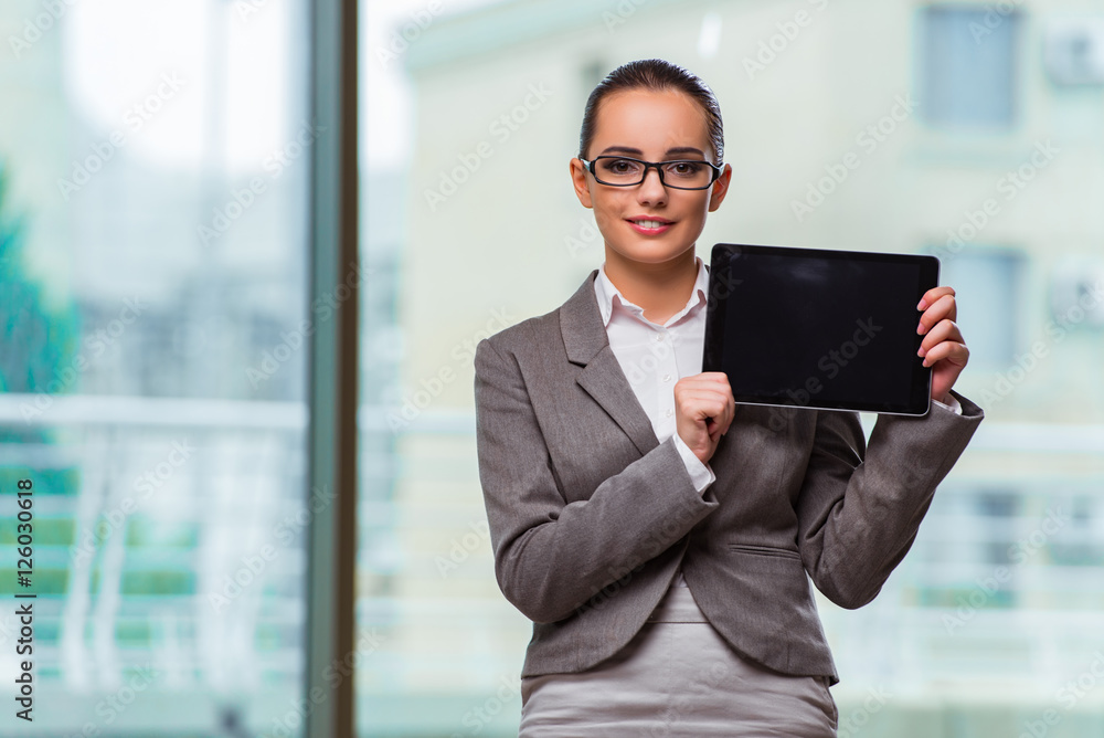 Woman working with tablet in office Woman working with tablet in office