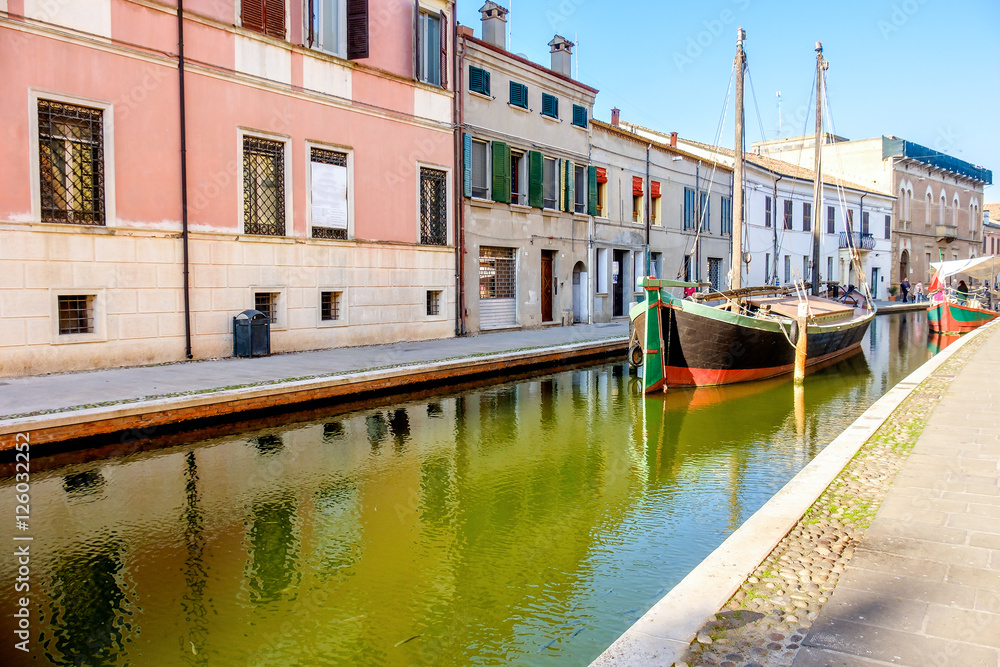 Obraz premium boat canal colorful italian village Comacchio Italy