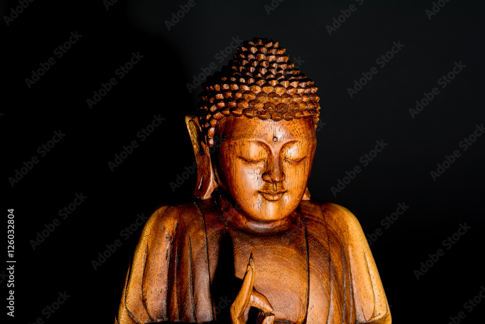 Low Key Portraiture of wooden Budda Statue, Thailand