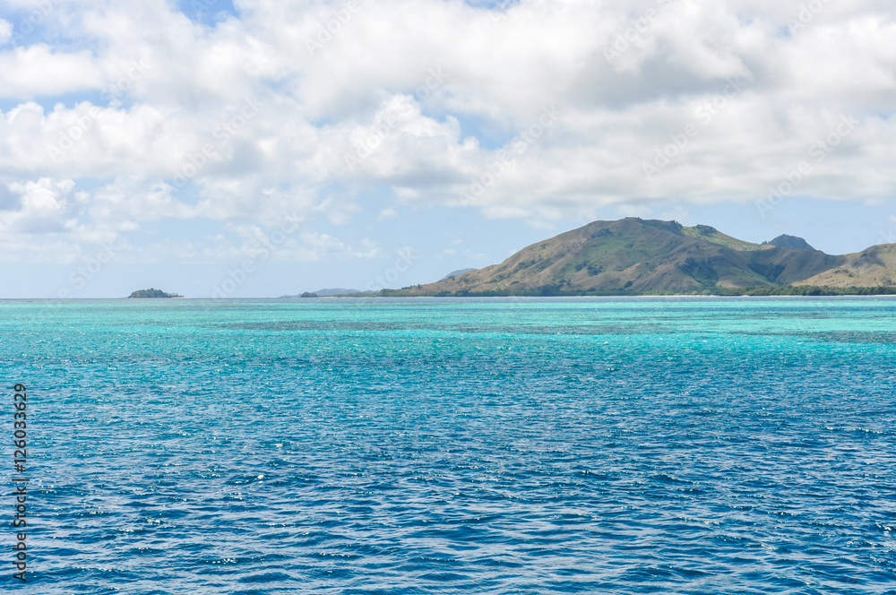 Fototapeta premium Colorful water near Nacula Island in Fiji