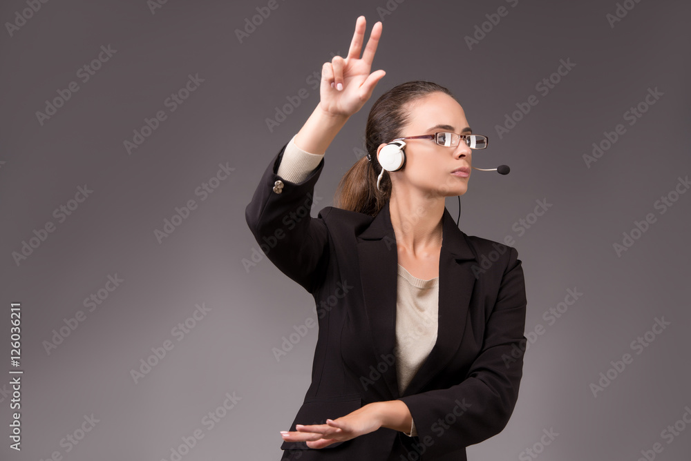 Young woman businesswoman pressing virtual buttons Young woman businesswoman pressing virtual buttons