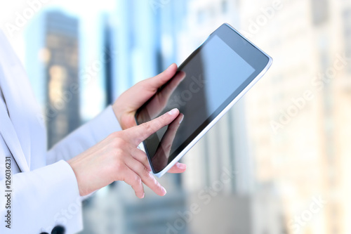 Business woman  working and analyzing financial figures on a gra