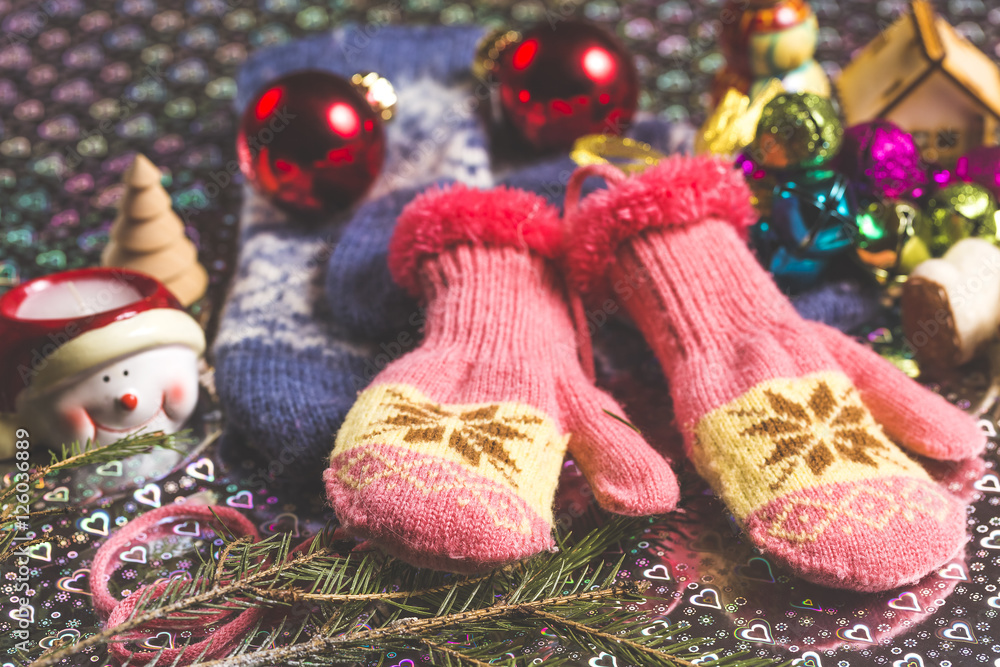Christmas theme with jingle bells, gloves, snowman, fir tree branch