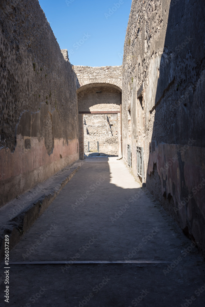 Narrow street in the ancient city of Pompeii, Italy