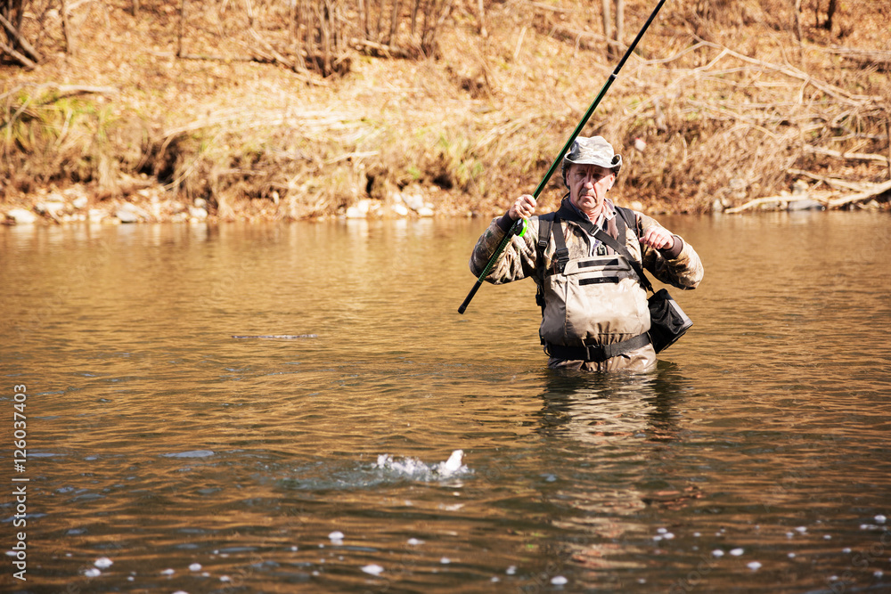 Lucky fisherman pulls caught grayling Lucky fisherman pulls caught grayling