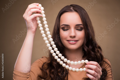 Young woman with pearl necklace