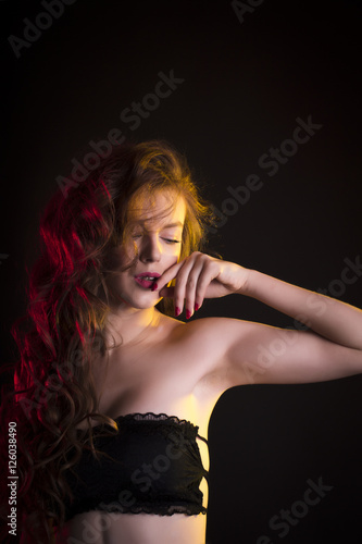 Luxurious woman with shadow on her face and long hair © vpavlyuk