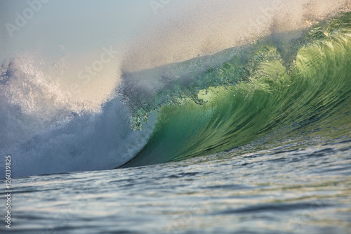 Fototapeta Naklejka Na Ścianę i Meble -  Shining Translucent Ocean Background Shorebreak Wave for Surfing