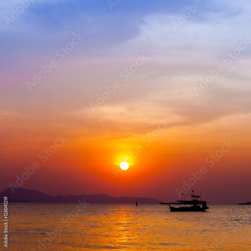 Beautiful landscape. sunset on the beach with fishing boat