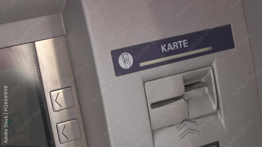 Person withdrawing money from ATM. Person withdrawing money from ATM.