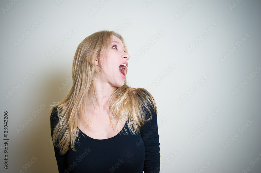 Astonished screaming young blonde woman portrait Astonished screaming young blonde woman portrait