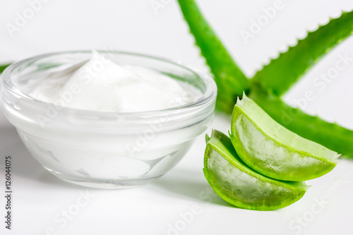aloe vera - leaves and cream isolated on white background