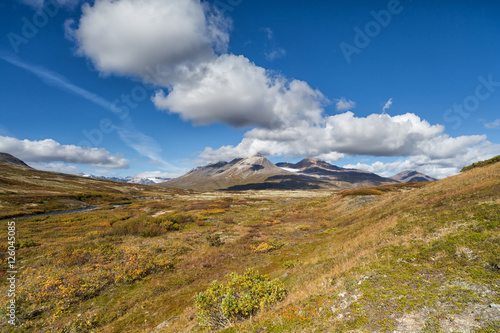 Indian summer landscape in the Yukon in Canada with cloud format