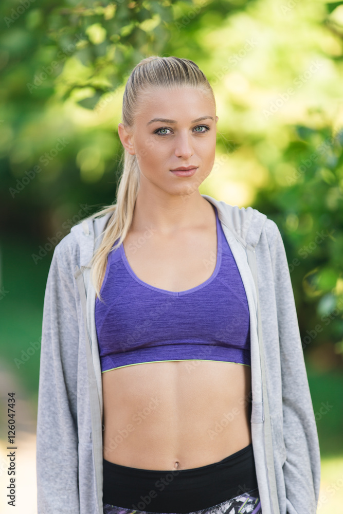 Portrait of athletic young woman resting after jogging. Portrait of athletic young woman resting after jogging.