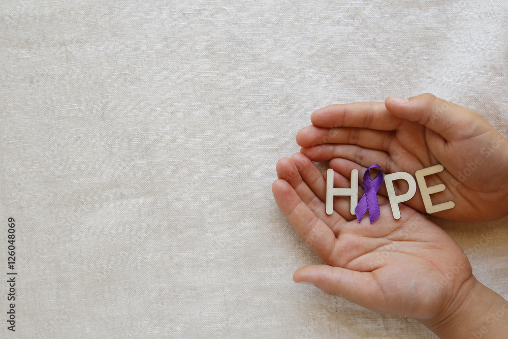 Hands holding HOPE with Purple ribbon, copy space background, Alzheimer's disease, Pancreatic cancer, Epilepsy awareness, Hodgkin's Lymphoma awareness