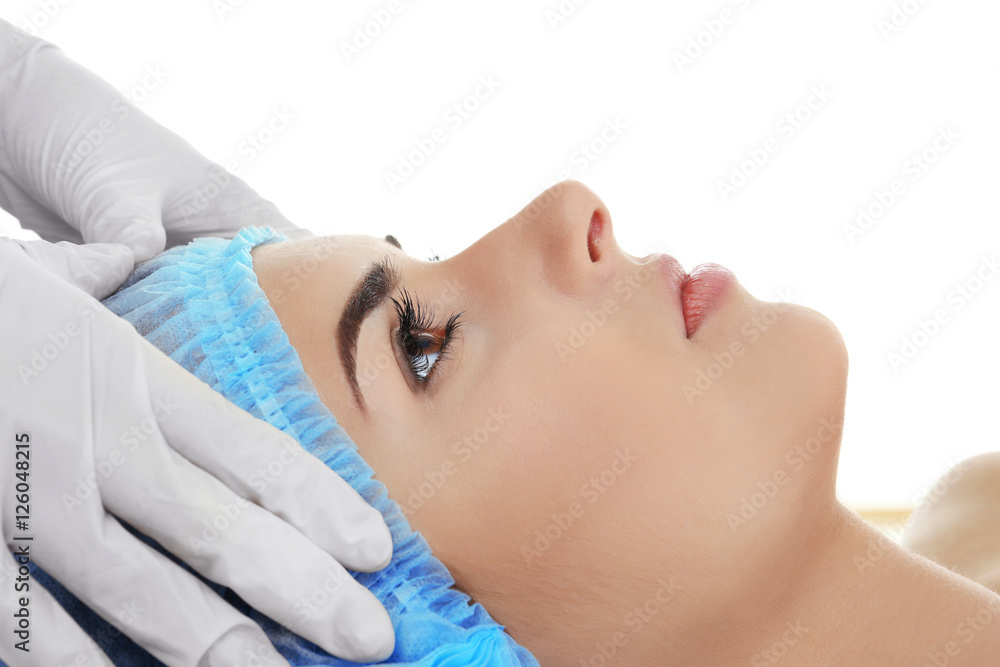 Plastic surgery concept. Doctor checking female face before plastic surgery