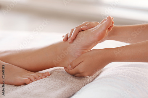 Foot massage in spa salon © Africa Studio