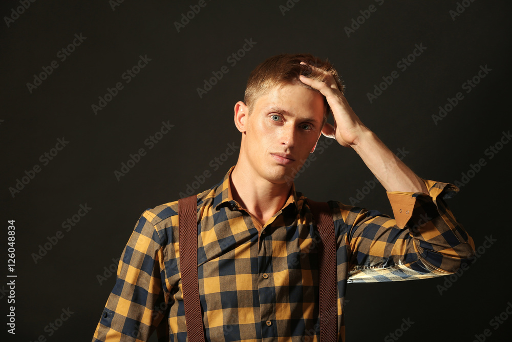 Portrait of stylish man on dark background Portrait of stylish man on dark background