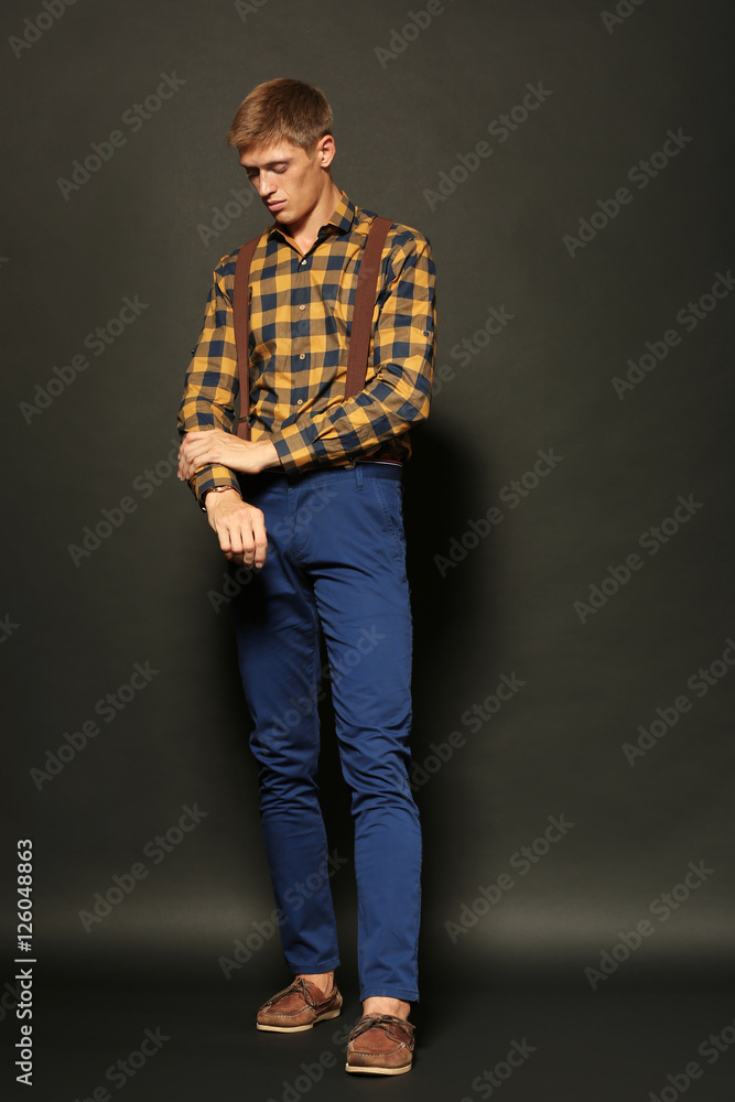 Funny stylish man on dark background Funny stylish man on dark background