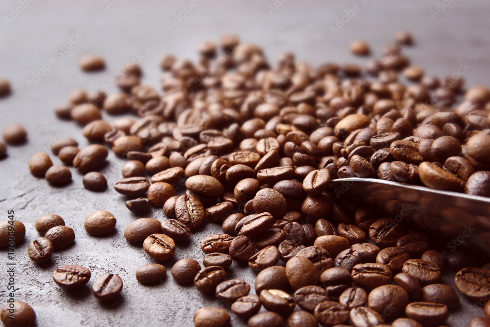 Coffee beans with scoop, close up Coffee beans with scoop, close up