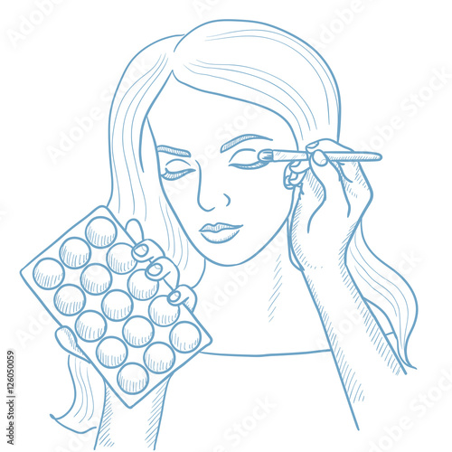 Visagiste doing makeup to young girl.