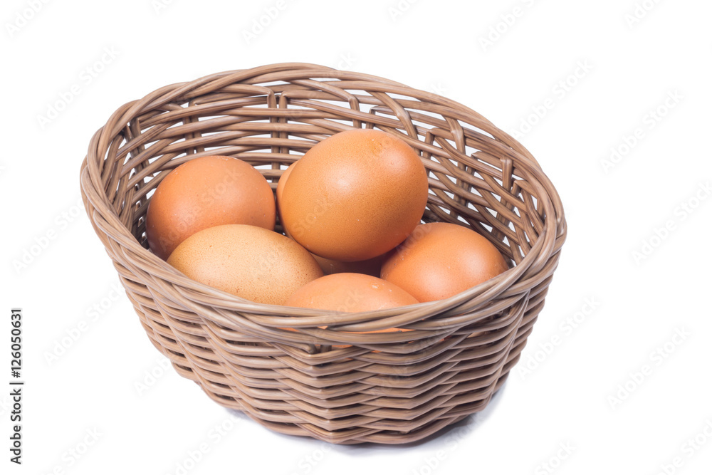 egg in basket wicker on white background
