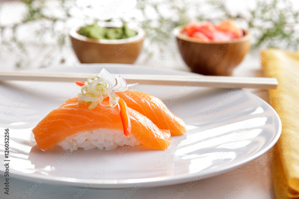 japanese food nigiri salmon sushi on white plate japanese food nigiri salmon sushi on white plate