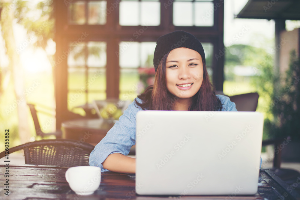 Beautiful young hipster woman sitting in a coffee shop, relax an Beautiful young hipster woman sitting in a coffee shop, relax an