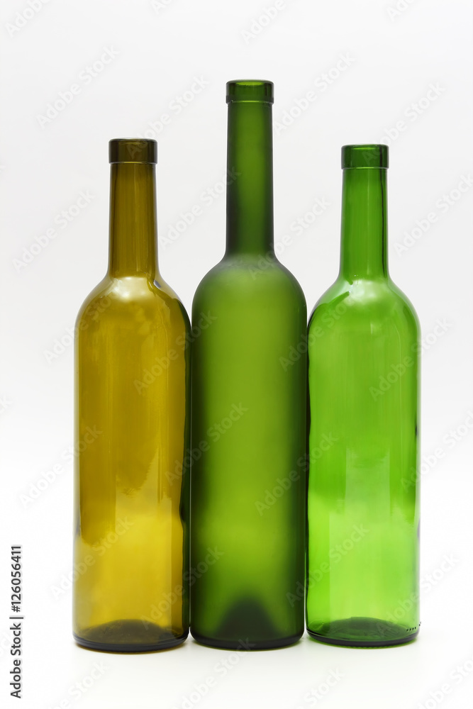 three empty bottles of wine on white background three empty bottles of wine on white background