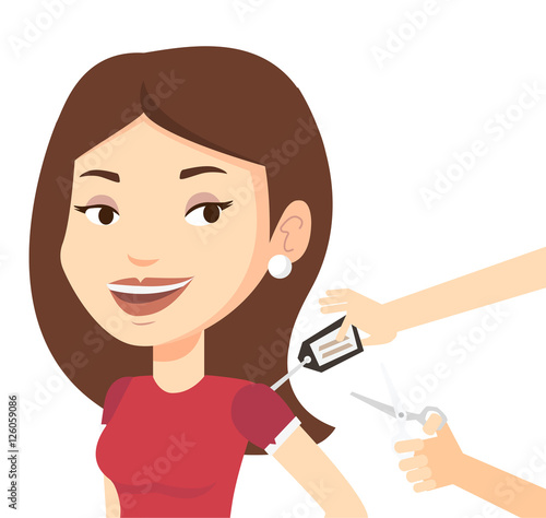Woman cutting price tag off new t-shirt.