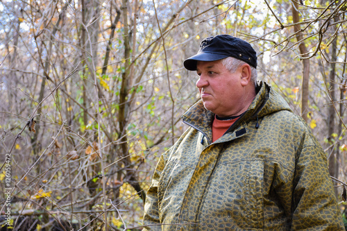 Mature caucasian man in the autumn forest