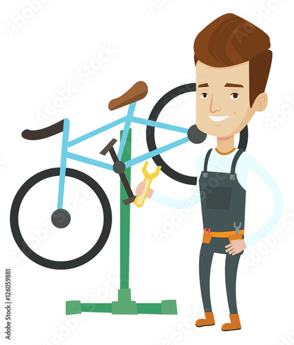 Caucasian bicycle mechanic working in repair shop.