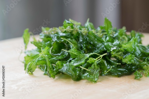 Canvas Print Holy basil fried on a wooden cutting board