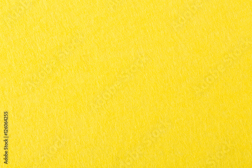 Background of bright yellow felt.