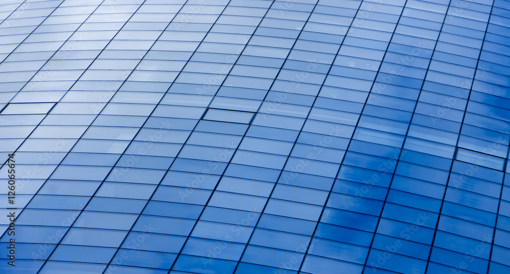 wall glass skyscraper with reflection of the sky at night. wall glass skyscraper with reflection of the sky at night.