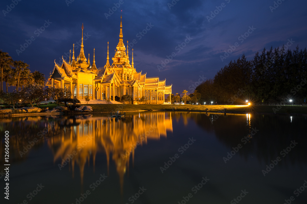 Wat Luang Pho Toh temple with water reflection in night time, Th