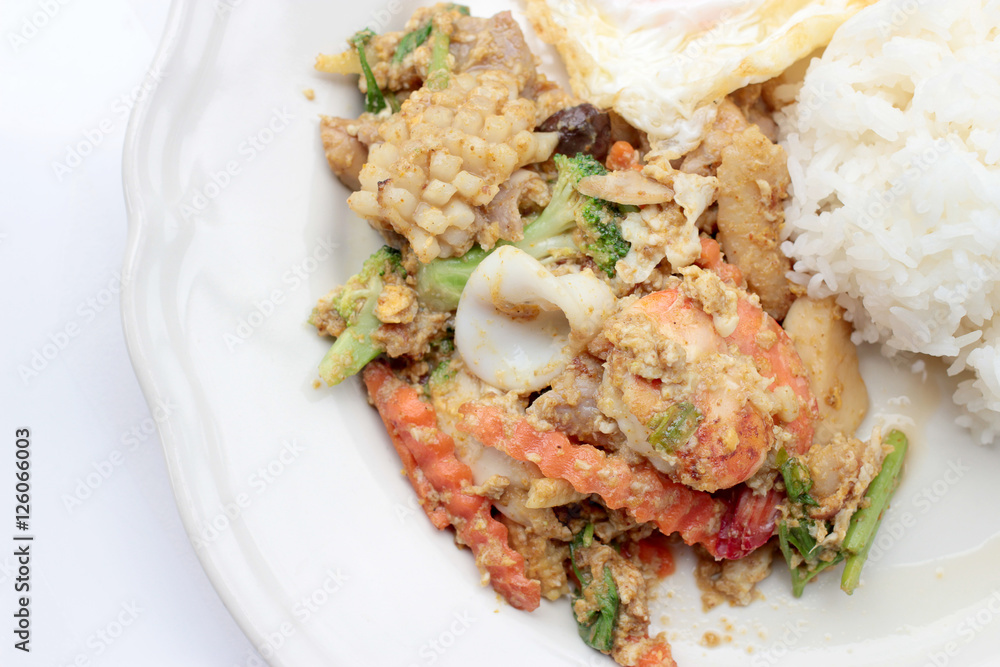 Stir-fried Soft-shelled seafood in curry powder & Thai jasmine rice Stir-fried Soft-shelled seafood in curry powder & Thai jasmine rice