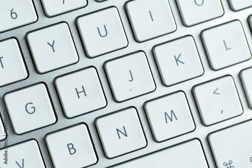 Close up of white wireless aluminum keyboard Close up of white wireless aluminum keyboard