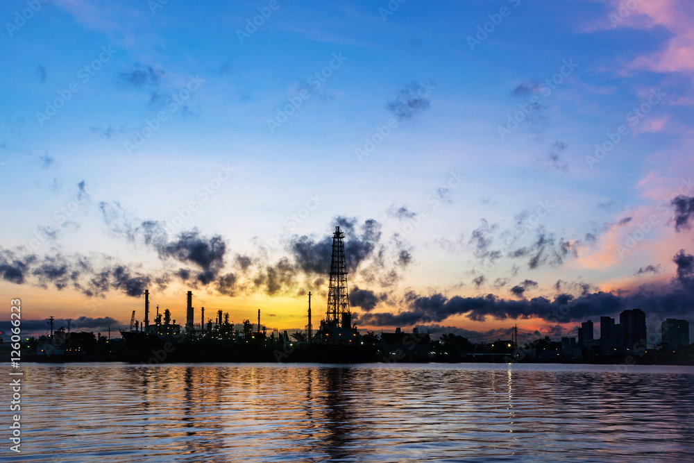 Oil refinery industry plant. Silhouette of oil refinery is locat