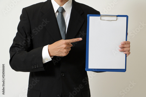 business person points a document