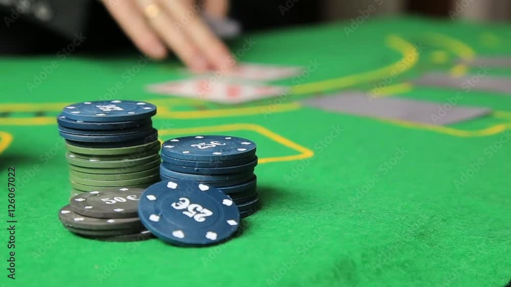Casino table with poker player hands and playing card Casino table with poker player hands and playing card
