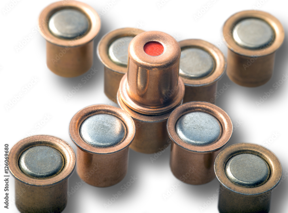 Igniter capsules of 12 gauge cartridges isolated Igniter capsules of 12 gauge cartridges isolated