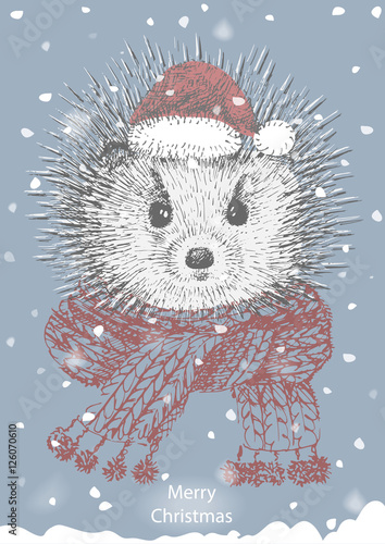 Christmas card of a hedgehog in a scarf and Christmas hat