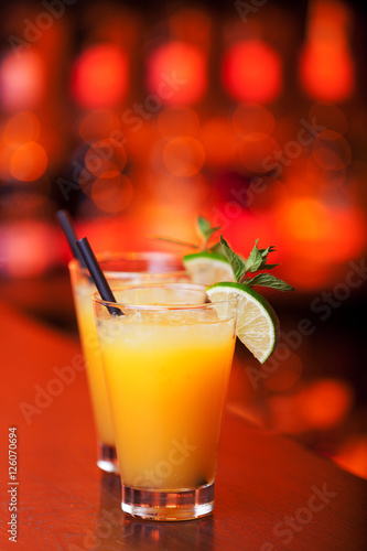 Harvey Wallbanger cocktails on a bar counter in a nightclub