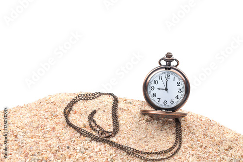 pocket clock on the beach with white background