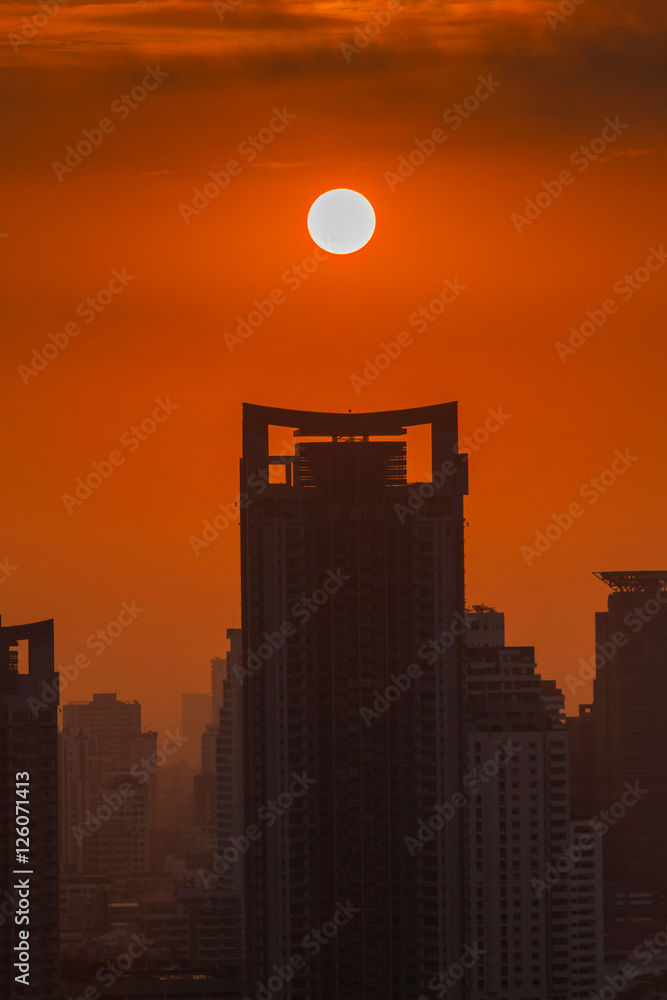 Big sun rising over Bangkok city skyline, Cityscape sunset Big sun rising over Bangkok city skyline, Cityscape sunset