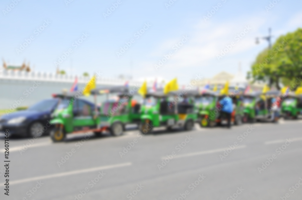 Blurred background : Traveler in the three-wheeler(Tuk-Tuk) travel around the Bangkok,Thailand Blurred background : Traveler in the three-wheeler(Tuk-Tuk) travel around the Bangkok,Thailand