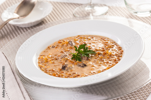 Lentil soup on a white plate