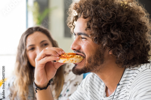 Slika na platnu Man eating pizza