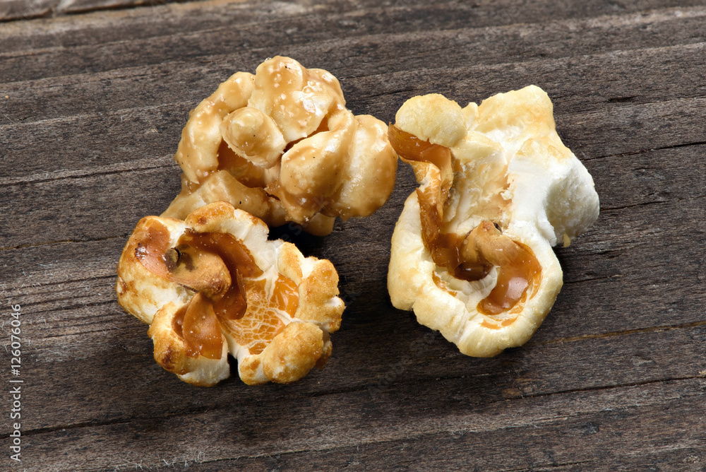 close up of popcorn on wooden background